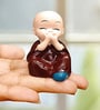 (Pack of 4) Monks Buddha Polyresin Religious Idol (Multicolor)