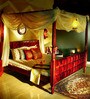 Alara Sheesham Wood Queen Size Poster Bed in Honey Oak Finish