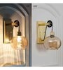Ambre Single Light Wall Light In Amber & Brass Finish
