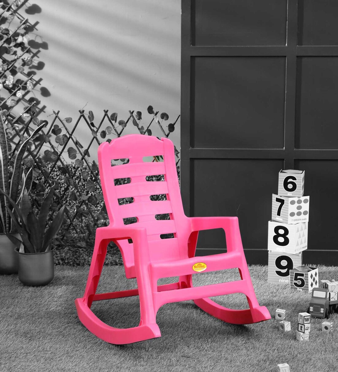 pink plastic rocking chair