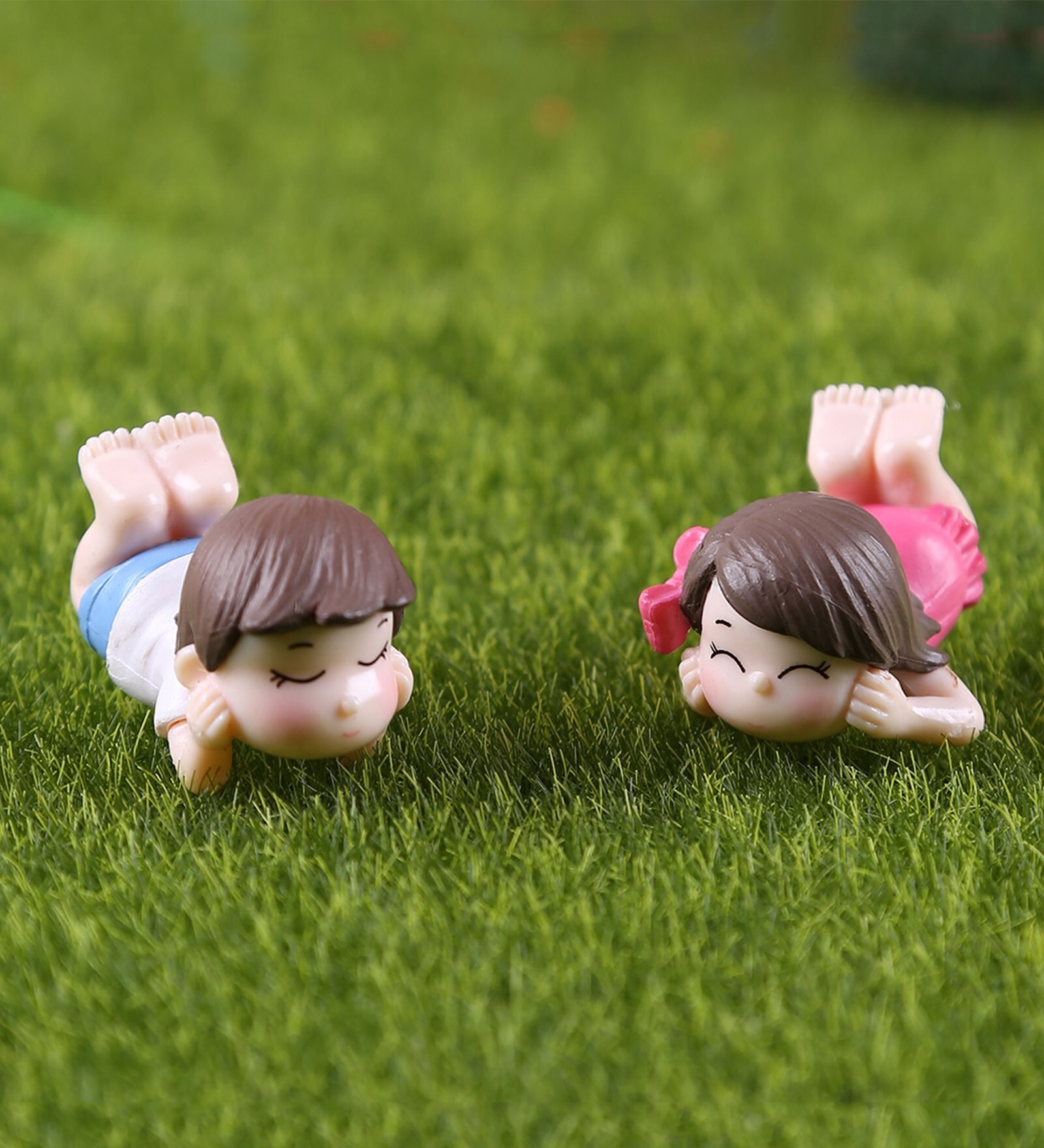 Boy And Girl Resting Garden Figurine