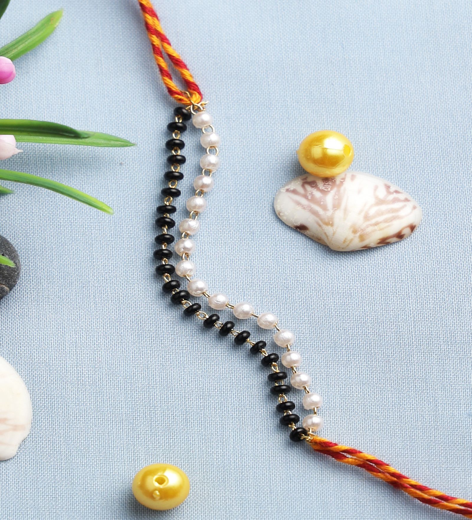 Buy Black & White Thread & Plastic Rakhi Set by Aapno Rajasthan at 17% ...