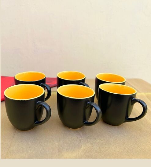 https://ii1.pepperfry.com/media/catalog/product/b/l/494x544/black---yellow-ceramic---set-of-6--tea-cup-black---yellow-ceramic---set-of-6--tea-cup-xexkin.jpg