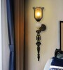 Black & Gold Metal Wall Sconce with Amber Glass Shade