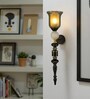 Black & Gold Metal Wall Sconce with Amber Glass Shade