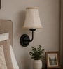 Black Wall Mounted Lamp with Beige Jute Shade & Dining Area