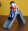 Blue Polyresin Lord Ganesha Enjoying Slide with Mushak Idol