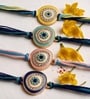 Blue Premium Handmade Evil Eye Crystal Stone Rakhi Set Of 4 With Anchor Non-Bleeding Cotton Thread