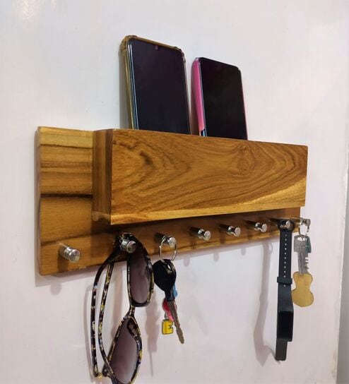 https://ii1.pepperfry.com/media/catalog/product/b/r/494x544/brown-wooden-key-holder-by-teakwoodkraft-brown-wooden-key-holder-by-teakwoodkraft-w4bgf6.jpg