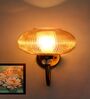 Brass Wall Sconce with Ribbed Kachori Amber Glass