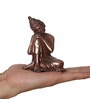 Brown Metal Resting Buddha On Knee