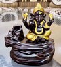 Brown Lord Ganesha Decorative Showpiece with 10 free Smoke Backflow Scented Cone Incenses