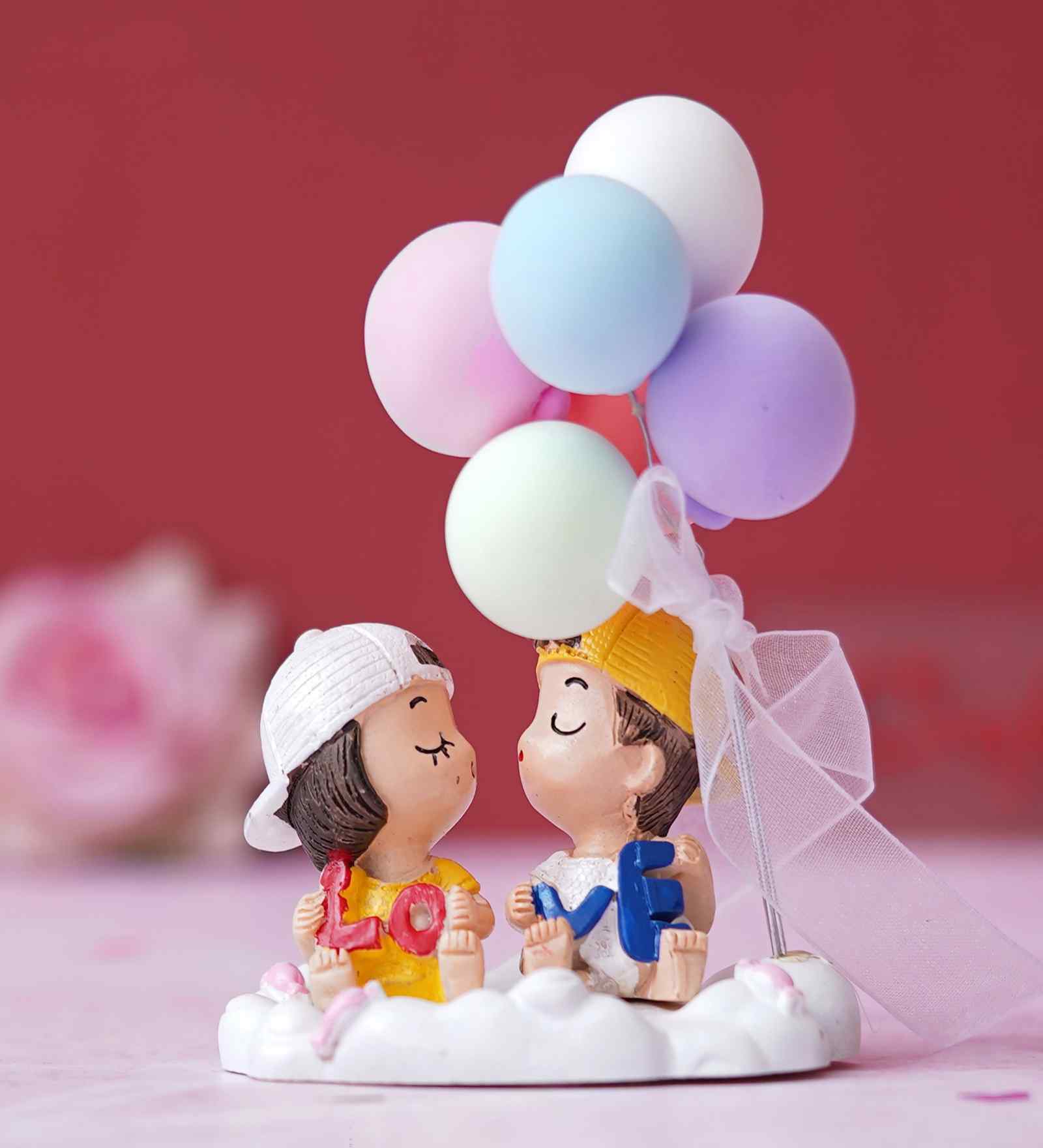 Cute Couple with Balloons Multicolour Polyresin Showpieces