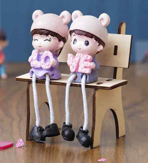 Cute Couple Sitting Beanch Multicolour Polyresin Showpieces