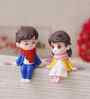 Cute Boy & Girl Sitting Multicolour Polyresin Showpieces
