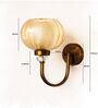 Decorative Brass Wall Light with Amber Glass Globe