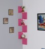 Engineered Wood Snack Shape Corner Wall Shelf In Pink Colour