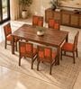 Dvira 6 Seater Dining Set In Provincial Teak Finish With Terracotta Orange Colour Chair Dvira 6 Seater Dining Set In Provincial Teak Finish With Terracotta Orange Colour Chair