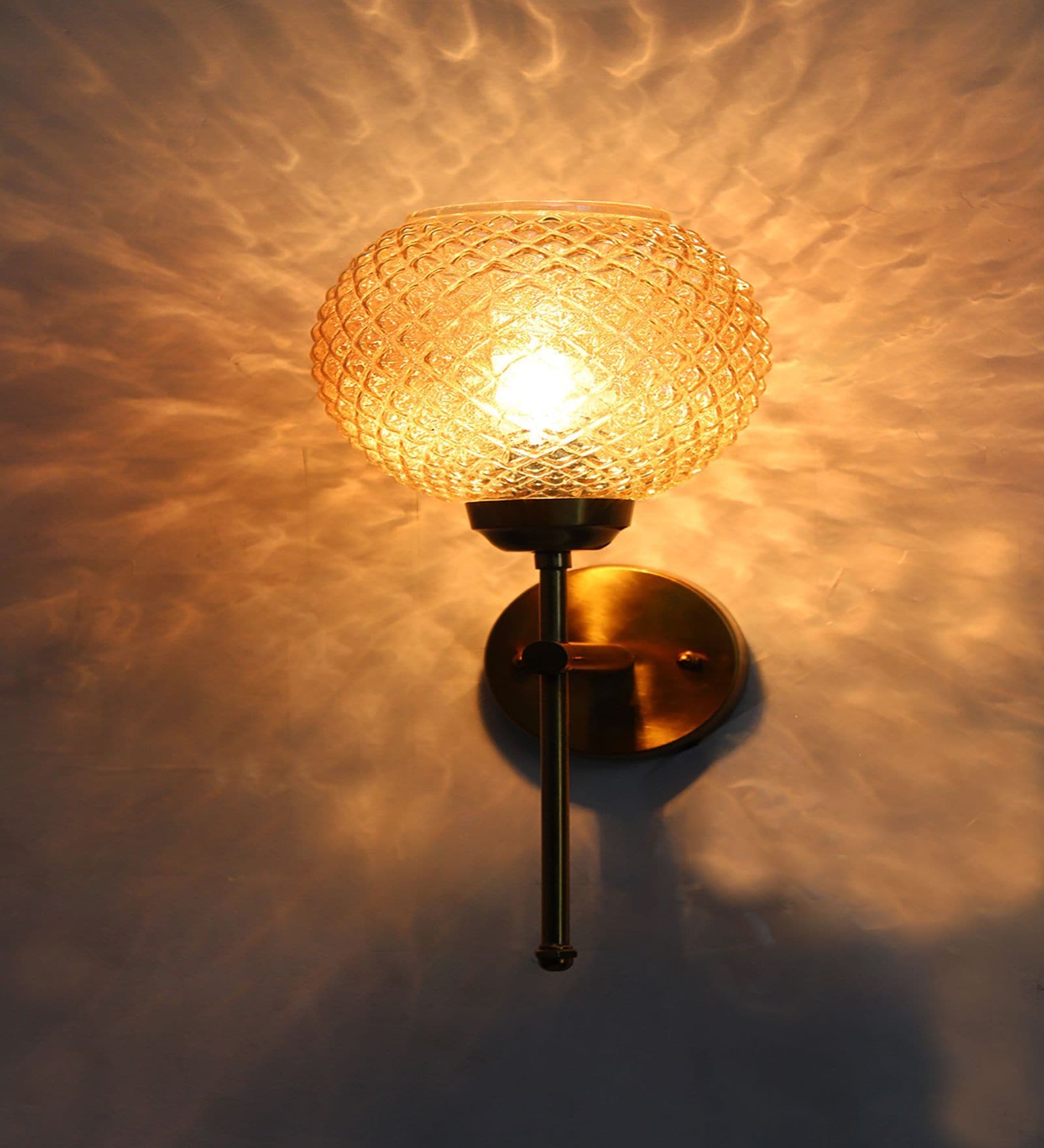 Elegant Brass Wall Sconce with Amber Crystal Globe Glass