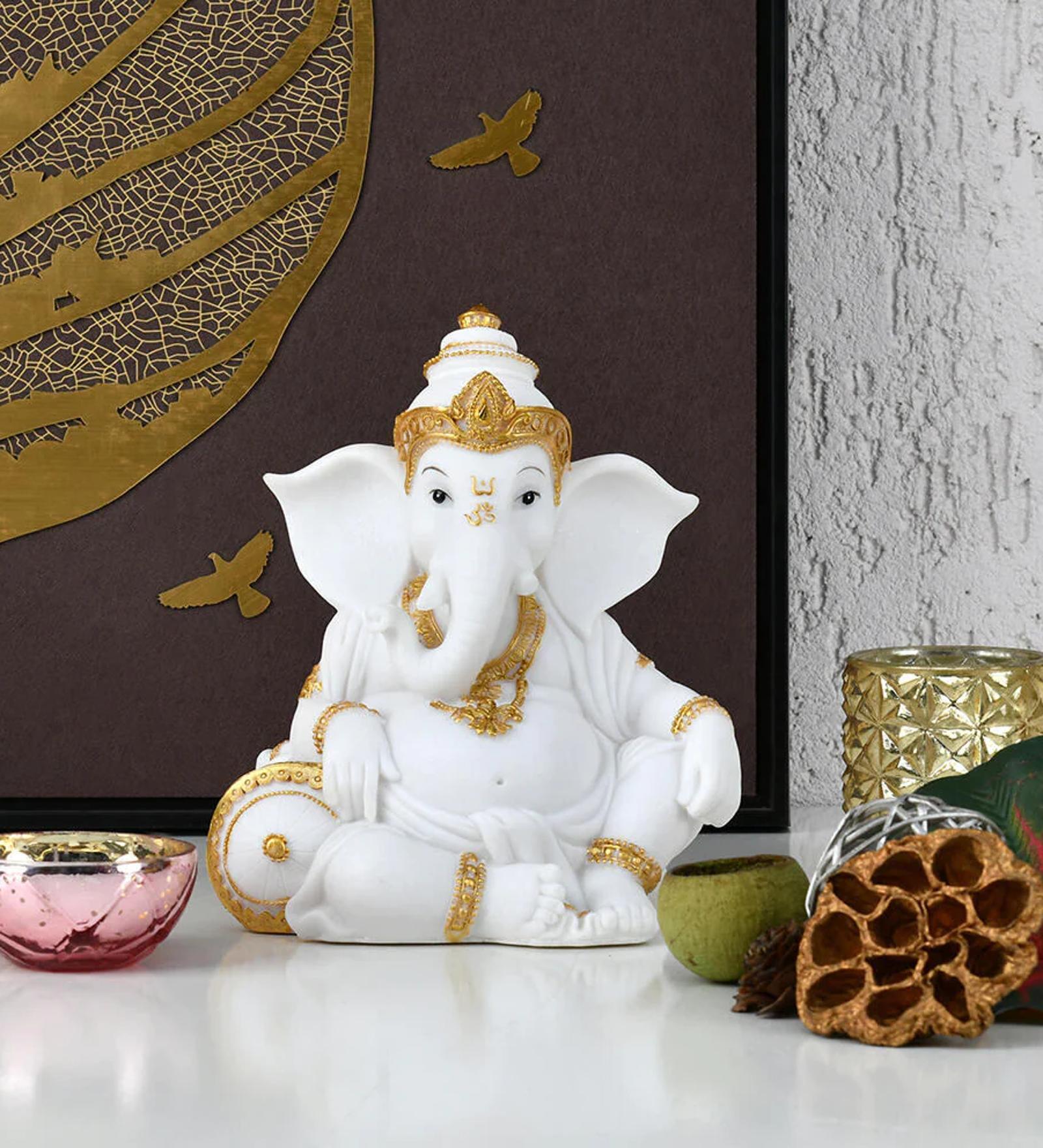 Ganesha Relaxing White & Gold Polyresin Religious Idols