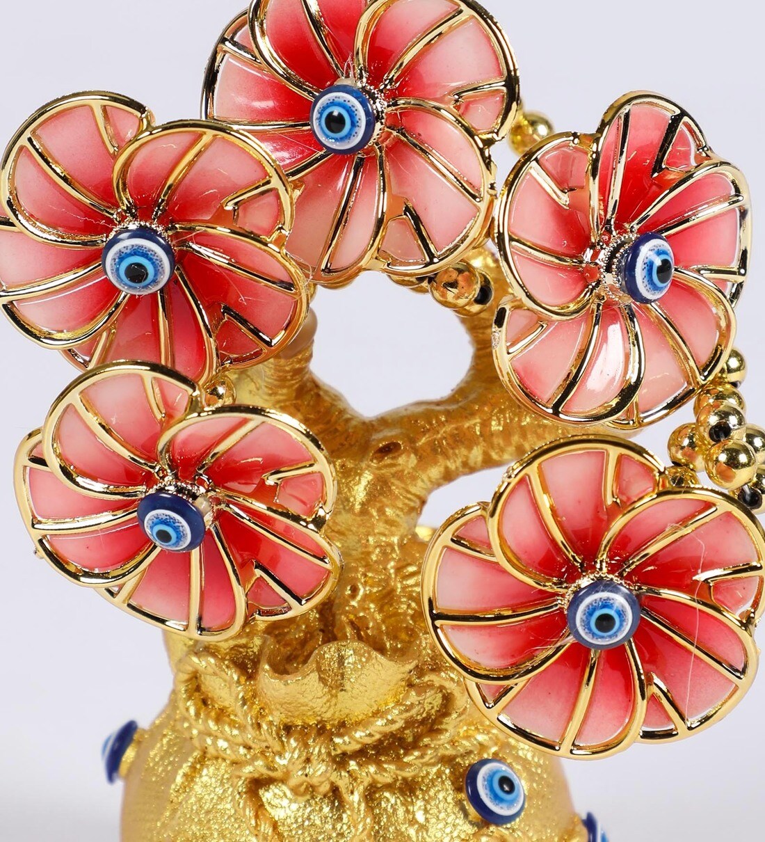 Buy Gold Evil Eye Artificial Flower Showpiece by Ethnic Karigari Online - Abstract Vintage Decor