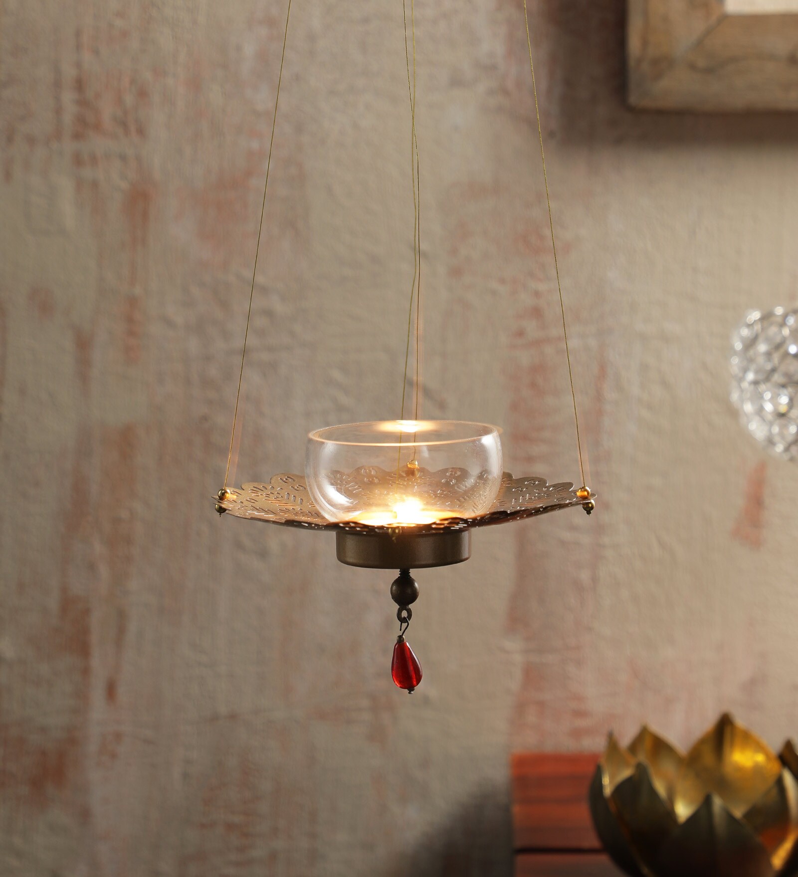 Buy Gold Metal Hanging Tea Light Holder by Dhatvi at 100 OFF by Dhatvi