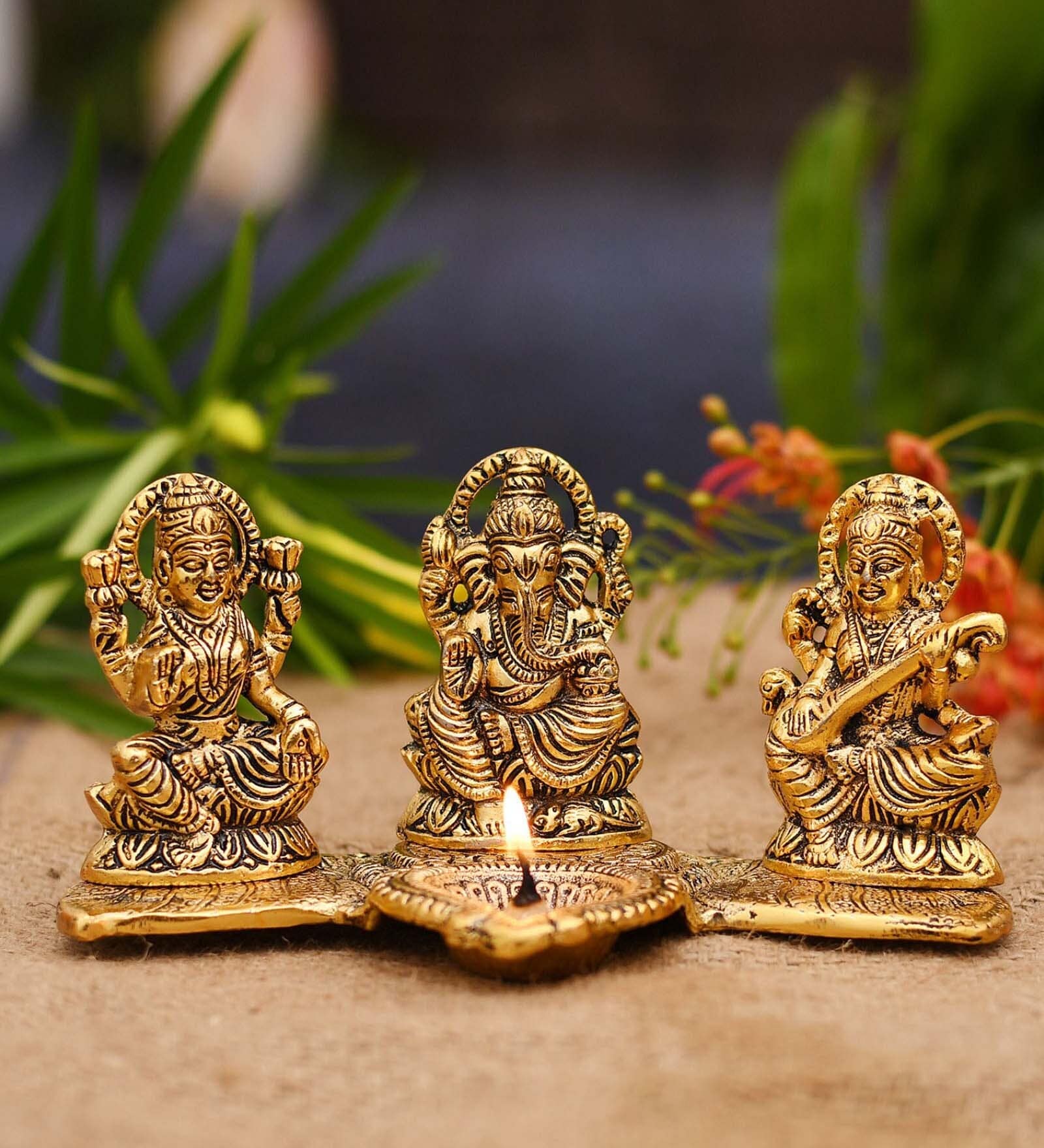 Golden Aluminium 8 Inch Lakshmi Ganesha Saraswati With Diya Idol
