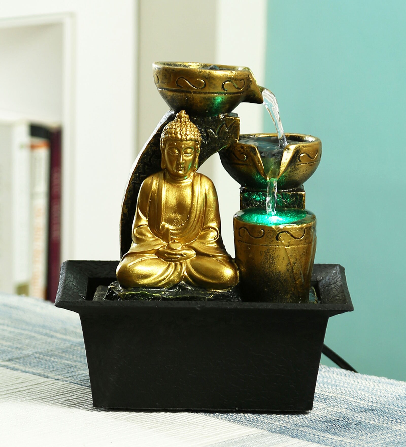 resin meditating buddha on column patio fountain with led light