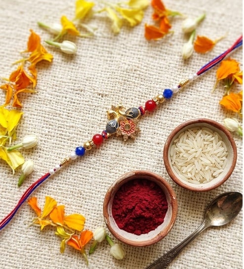 Gold & Blue Antique Two Peacock Rakhi With Soft Thread