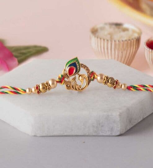Golden Peacock Colorful Feathers Designer Rakhi with Roli Chawal Pack
