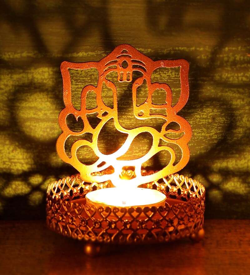 Buy Gold Metal Shadow Tea Light Holder by Heaven Decor Online Table