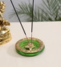 Gold Metal Tortoise Incense Holder Placed In Green Glass
