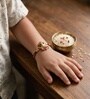 Gold Premium Ganesha Handmade Rakhi With Anchor Non-Bleeding Cotton Thread