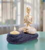 Gold-Toned & Black Meditating Figurine Showpiece Cum Candle Holder