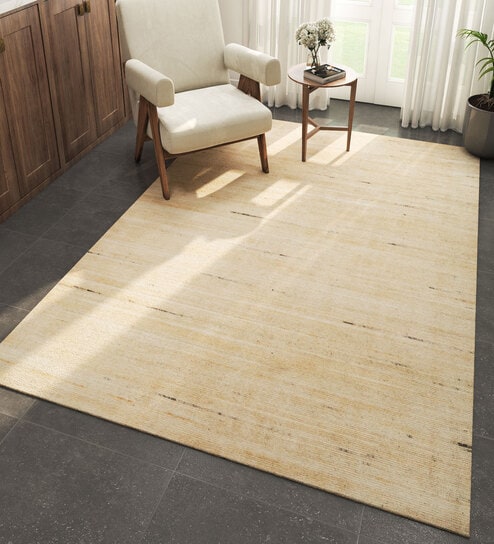 Ivory Solid Wool 6 ft X 9 ft Hand Woven Carpet