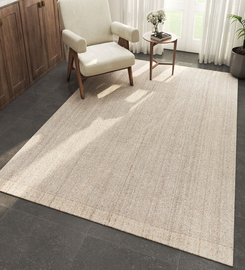 Ivory Solid Wool 6 ft X 9 ft Hand Woven Carpet