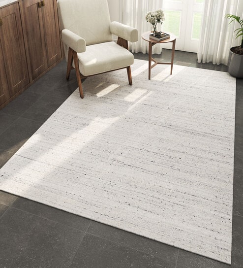 Ivory Solid Wool and Viscose 5 ft X 8 ft Hand Woven Carpet