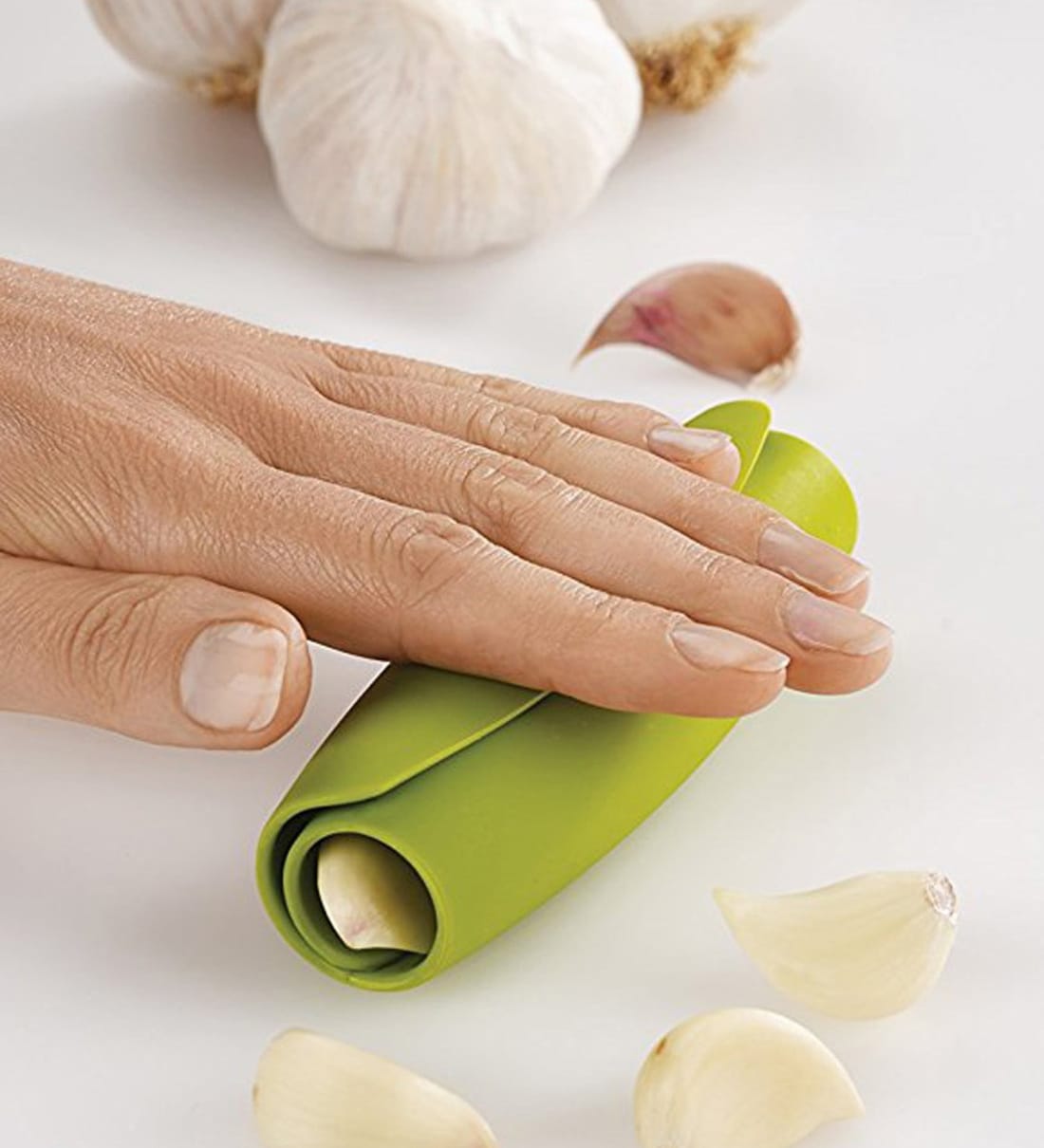 https://ii1.pepperfry.com/media/catalog/product/j/o/1100x1210/joseph-joseph-scroll-green-plastic-garlic-peeler-joseph-joseph-scroll-green-plastic-garlic-peeler-hti6nl.jpg