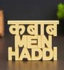 Kabab Mein Haddi Yellow Engineered Wood Showpiece