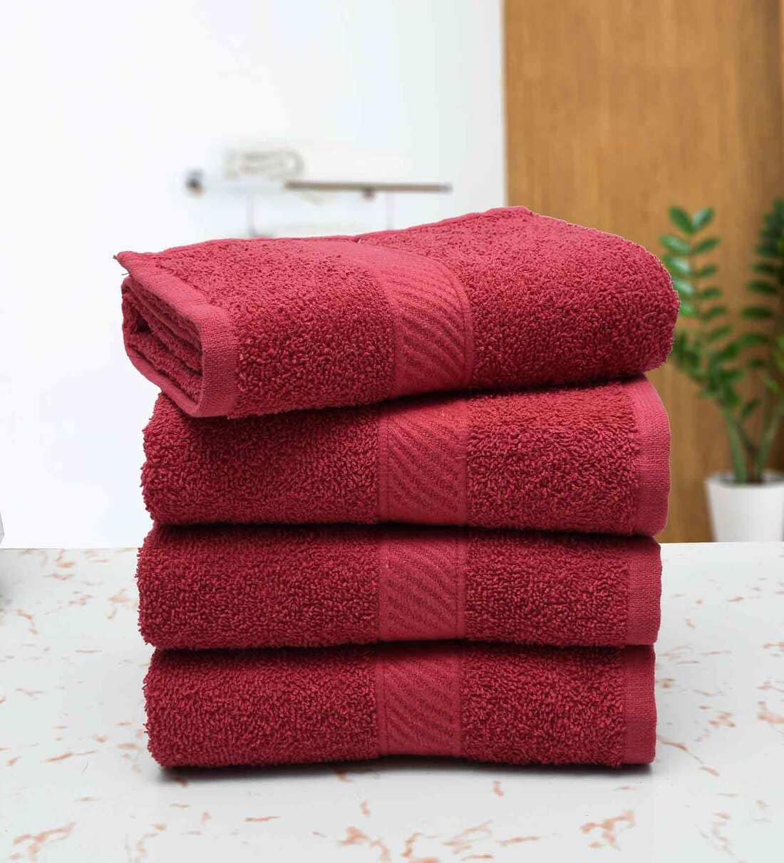 Buy Maroon Solid 400 GSM Cotton Hand Towels (Set of 4) by RANGOLI at 10