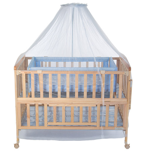 wooden cot with mosquito net