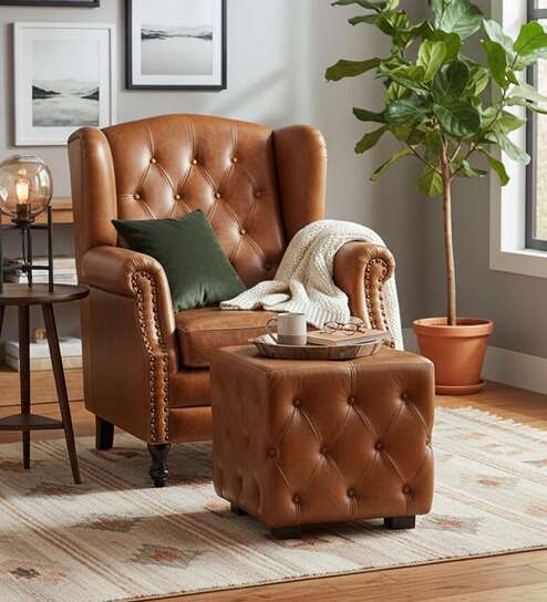 Miceli Leather Wing Chair With Pouffe In Tan Finish