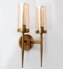 Modern Dual-Light Gold Wall Sconce with Amber Glass Cylindrical Shades