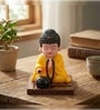 Yellow Moving Bobble Head Monk Buddha Idol Showpiece