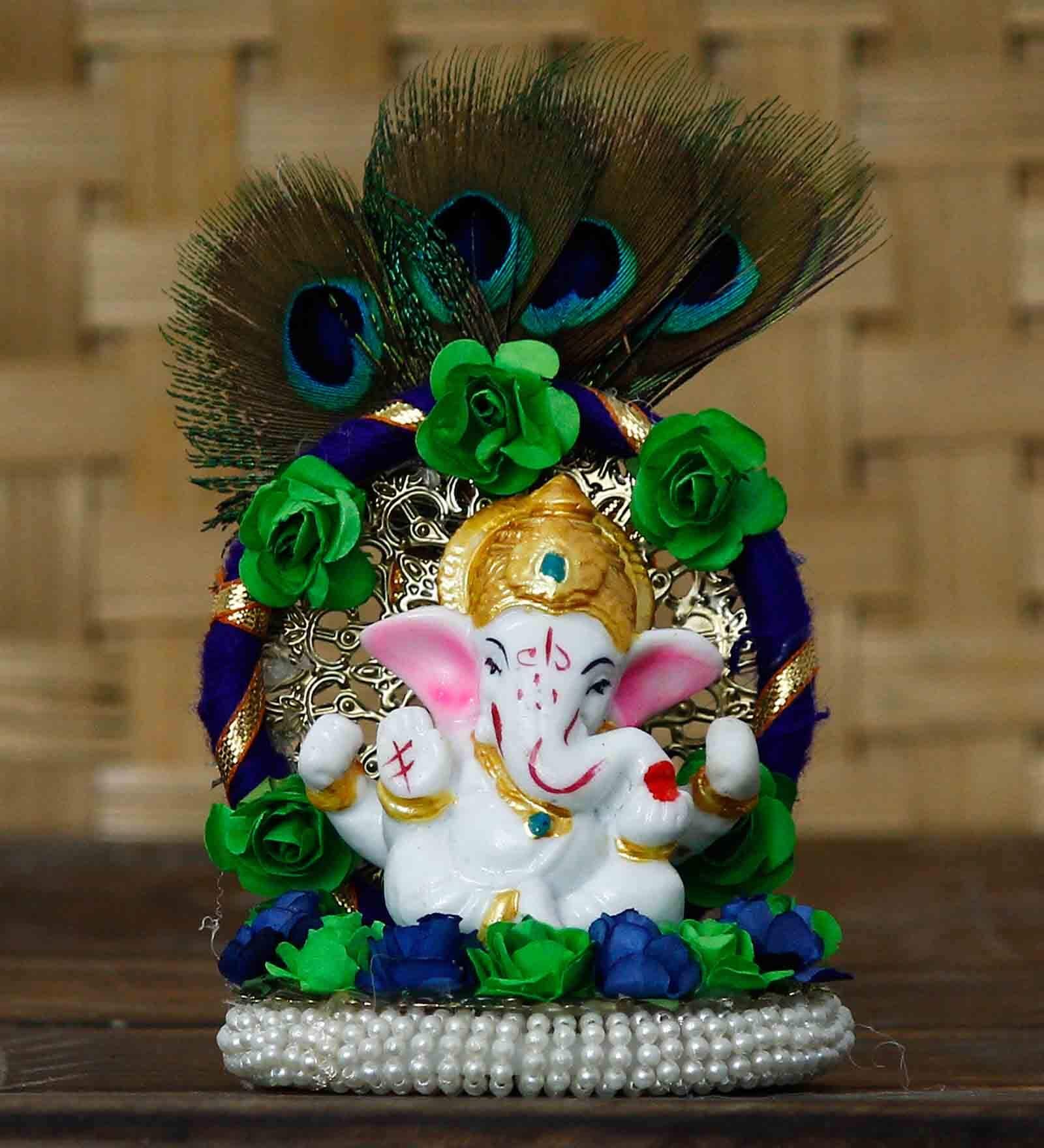 Multicolour Metal and Polyresin Lord Ganesha Idol on Decorative Handcrafted Floral Plate with Peocock Feather