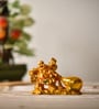 Multicolor Polyresin Laughing Buddha Pulling Potli Decorative Showpiece (7.5 cm)