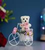 White Cycle With Teddy Bear And Rose Petals Showpiece