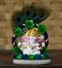 Multicolour Metal and Polyresin Lord Ganesha Idol on Decorative Handcrafted Floral Plate with Peocock Feather