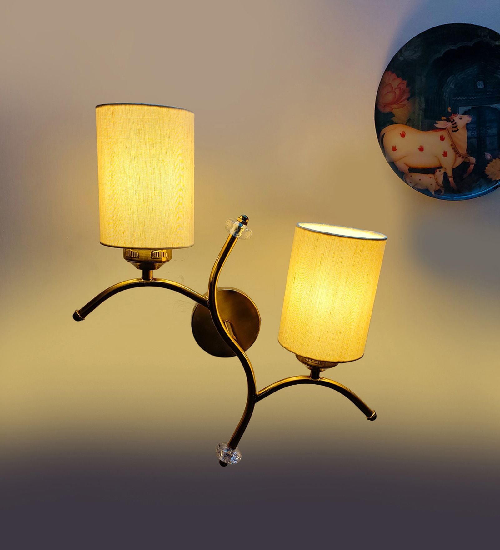 Dual wall mounted gold lamp with off-white Cotton Shade