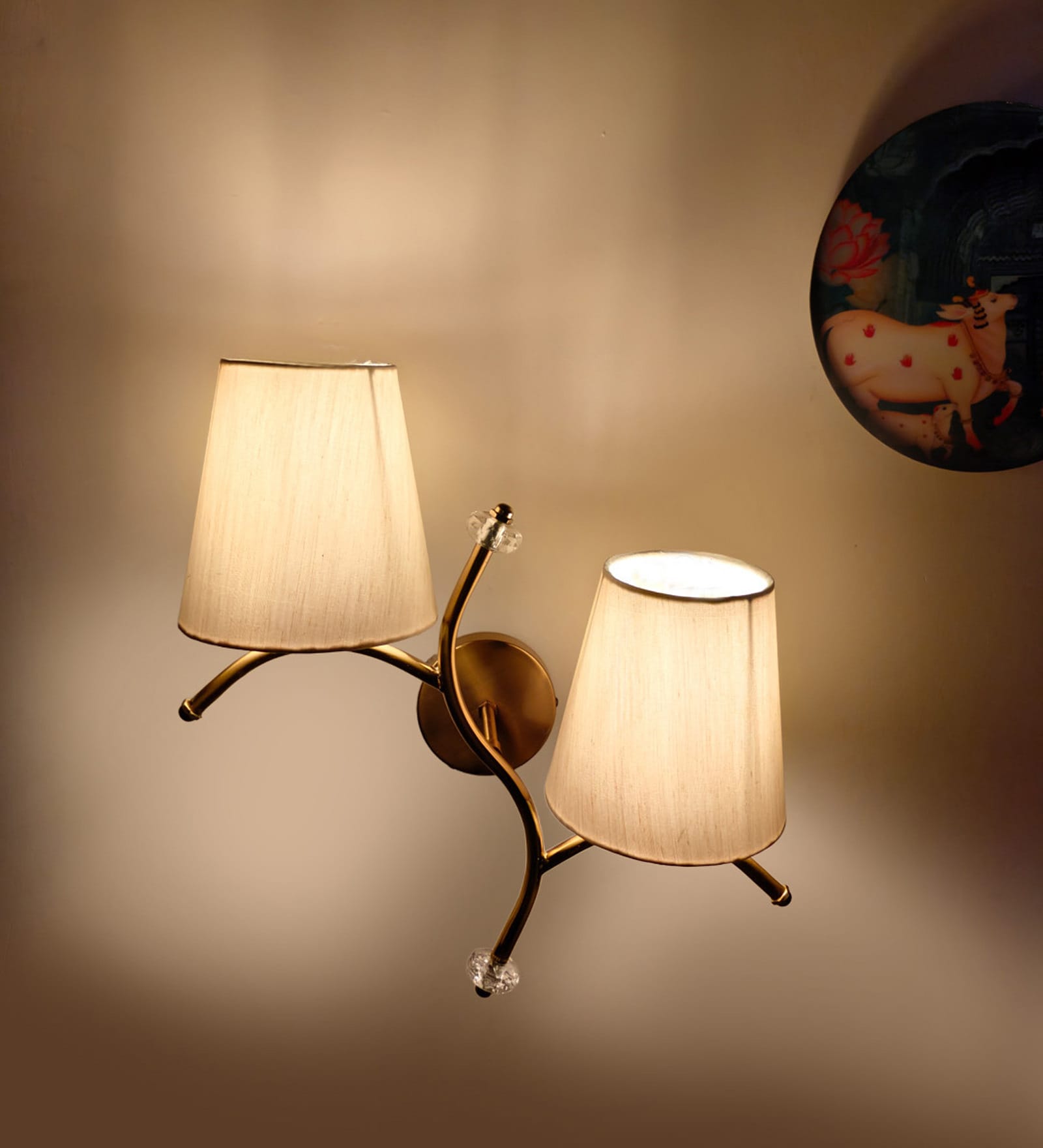 Dual wall mounted gold lamp with off-white Cotton Shade